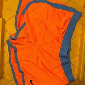 Nike women’s neon Orange Mesh Athletic Shorts with Blue Trim